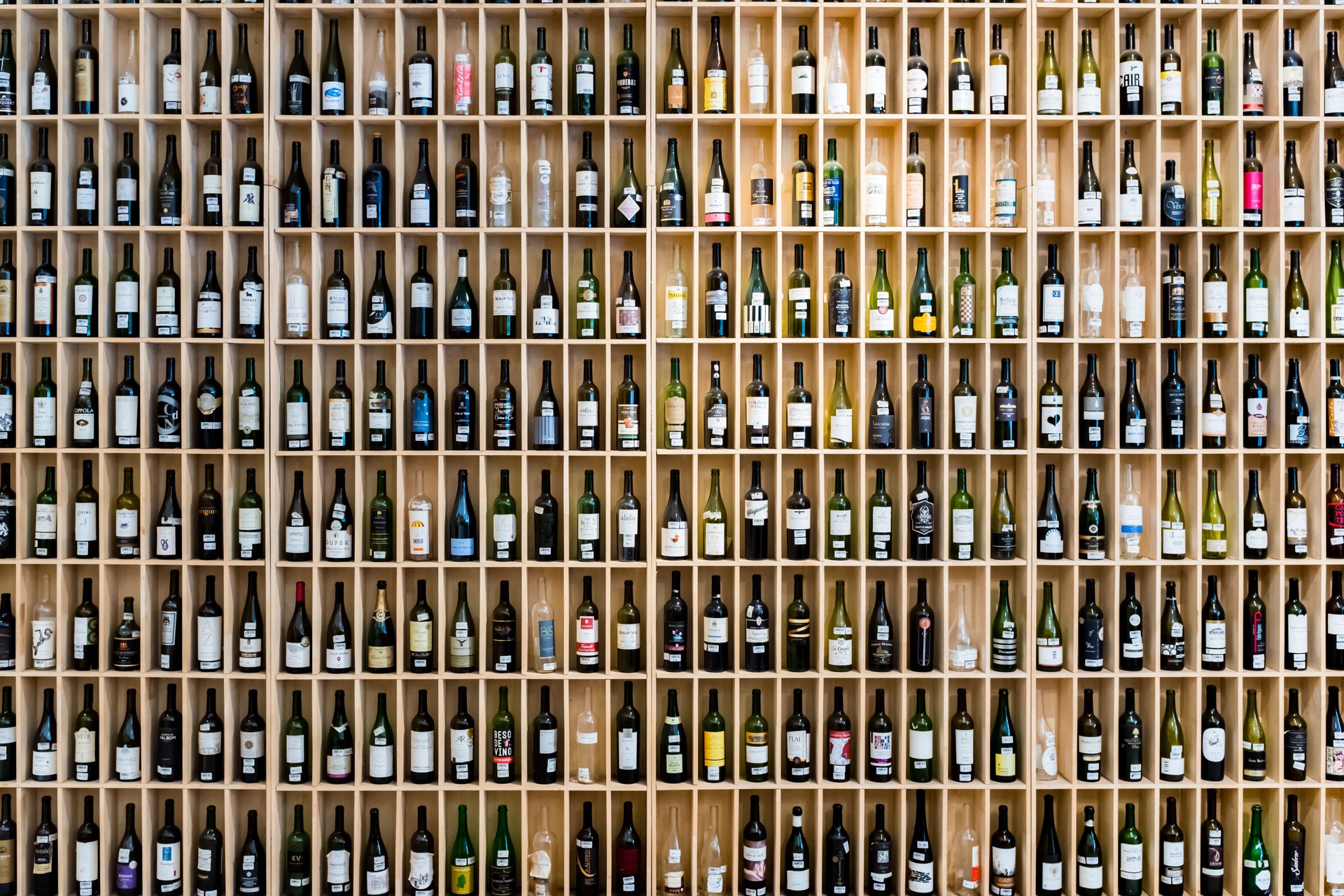 A large amount of wine on the shelf